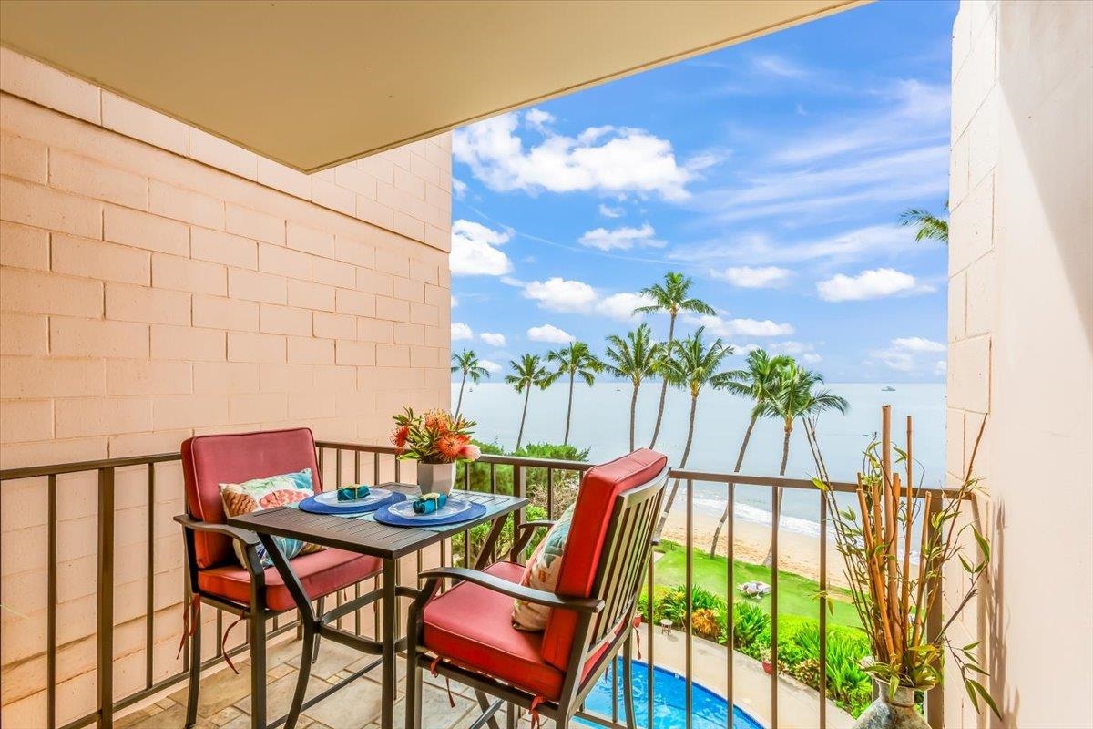 191 North Kihei Road, Unit 402 Kihei, HI 96753 - Photo 22 of 48 a balcony with dining table and chairs