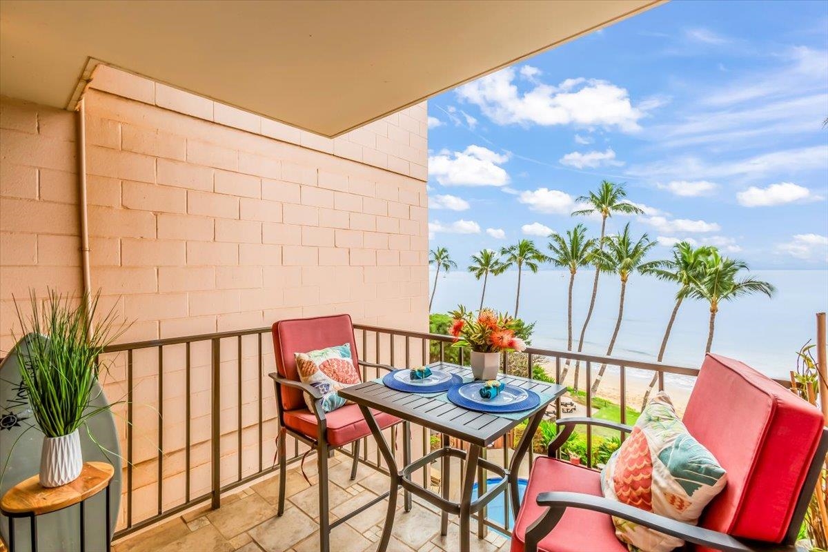 191 North Kihei Road, Unit 402 Kihei, HI 96753 - Photo 25 of 48 a balcony with table and chairs