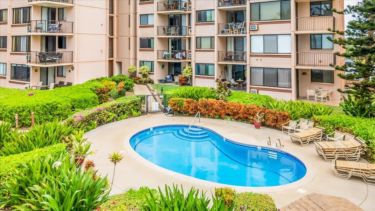 191 North Kihei Road, Unit 402 Kihei, HI 96753 - Photo 39 of 48 a view of a swimming pool with an outdoor seating