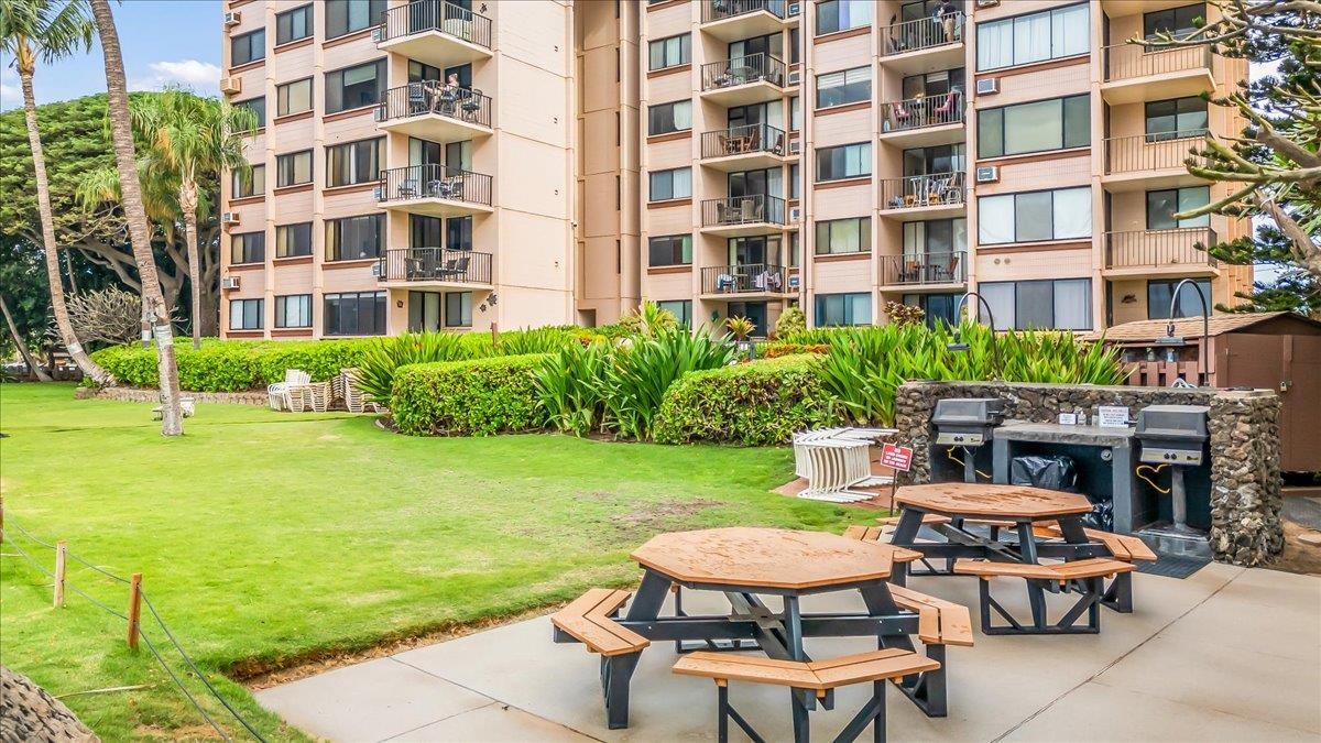 191 North Kihei Road, Unit 402 Kihei, HI 96753 - Photo 48 of 48 a view of a patio with table and chairs and potted plants