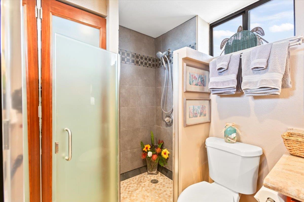 191 North Kihei Road, Unit 402 Kihei, HI 96753 - Photo 6 of 48 a bathroom with a sink toilet and shower