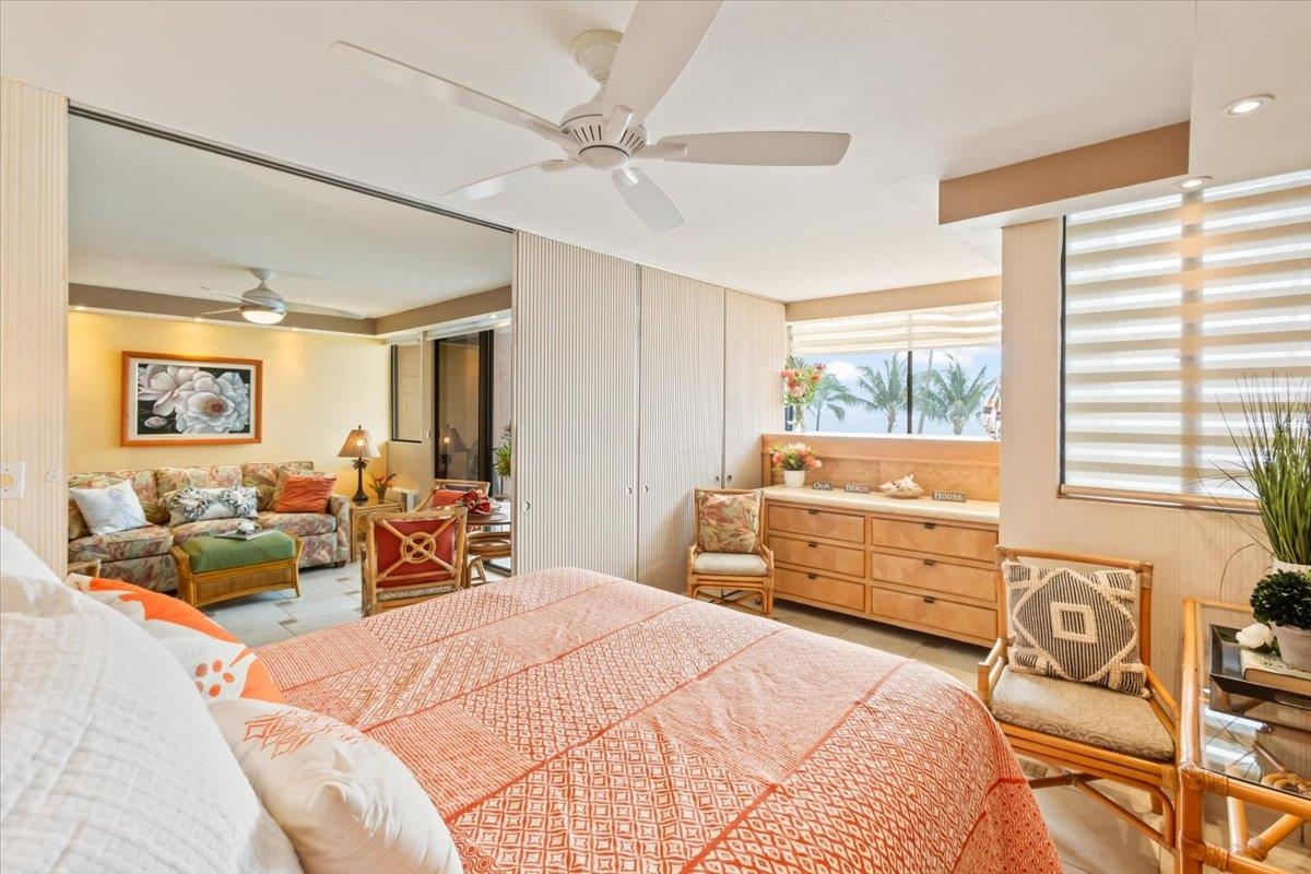 191 North Kihei Road, Unit 402 Kihei, HI 96753 - Photo 10 of 48 a bedroom with furniture and a large window