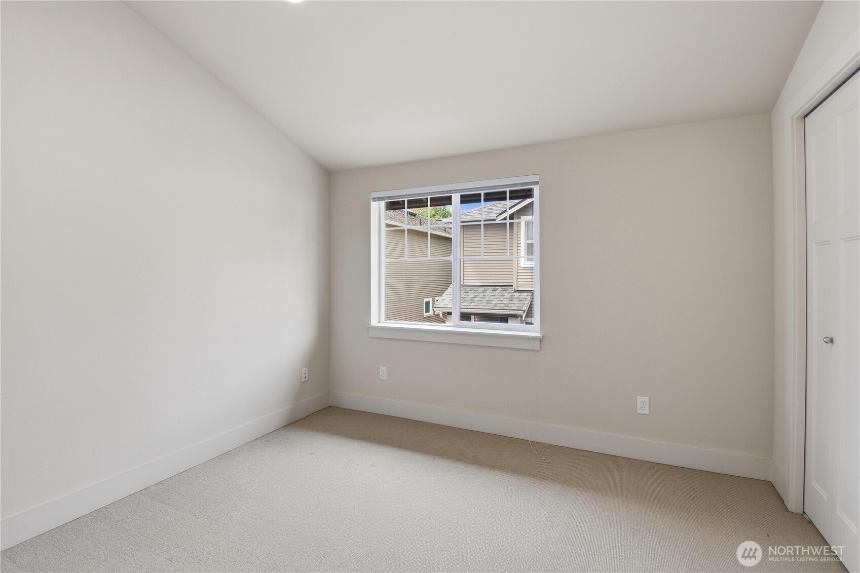 723 North 95th Street, Unit A Seattle, WA 98103 - Photo 17 of 20 an empty room with a window