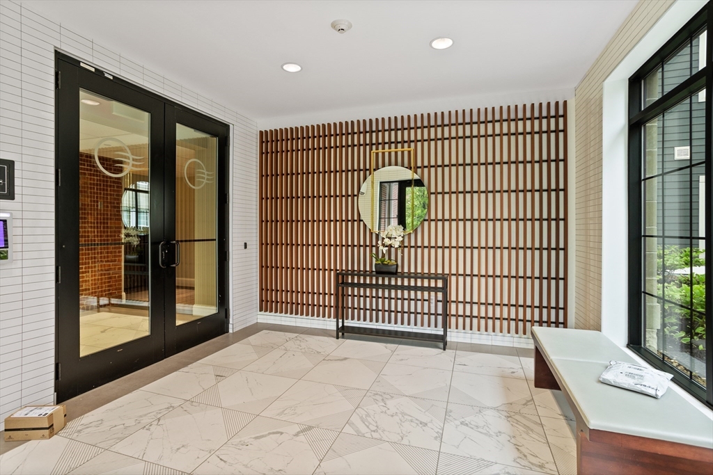 8 Sanborn Street, Unit 2012 Reading, MA 01867 - Photo 4 of 36 a view of a spacious with an entryway