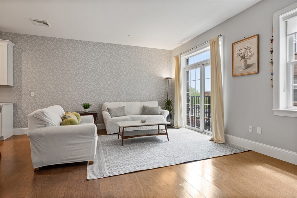 8 Sanborn Street, Unit 2012 Reading, MA 01867 - Photo 8 of 36 a living room with furniture and a large window