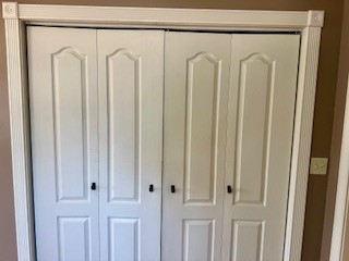 25 Max Drive Paris, TN 38242 - Photo 11 of 32 a view of a closet area with a mirror