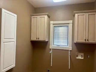 a view of walk in closet with window