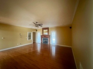 25 Max Drive Paris, TN 38242 - Photo 16 of 32 wooden floor in an empty room with a window