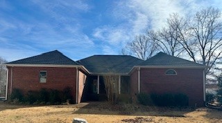 25 Max Drive Paris, TN 38242 - Photo 26 of 32 a front view of a house with a yard