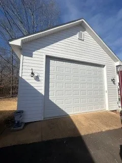 a front view of a house with a garage
