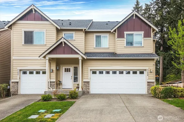 a front view of a house with garage