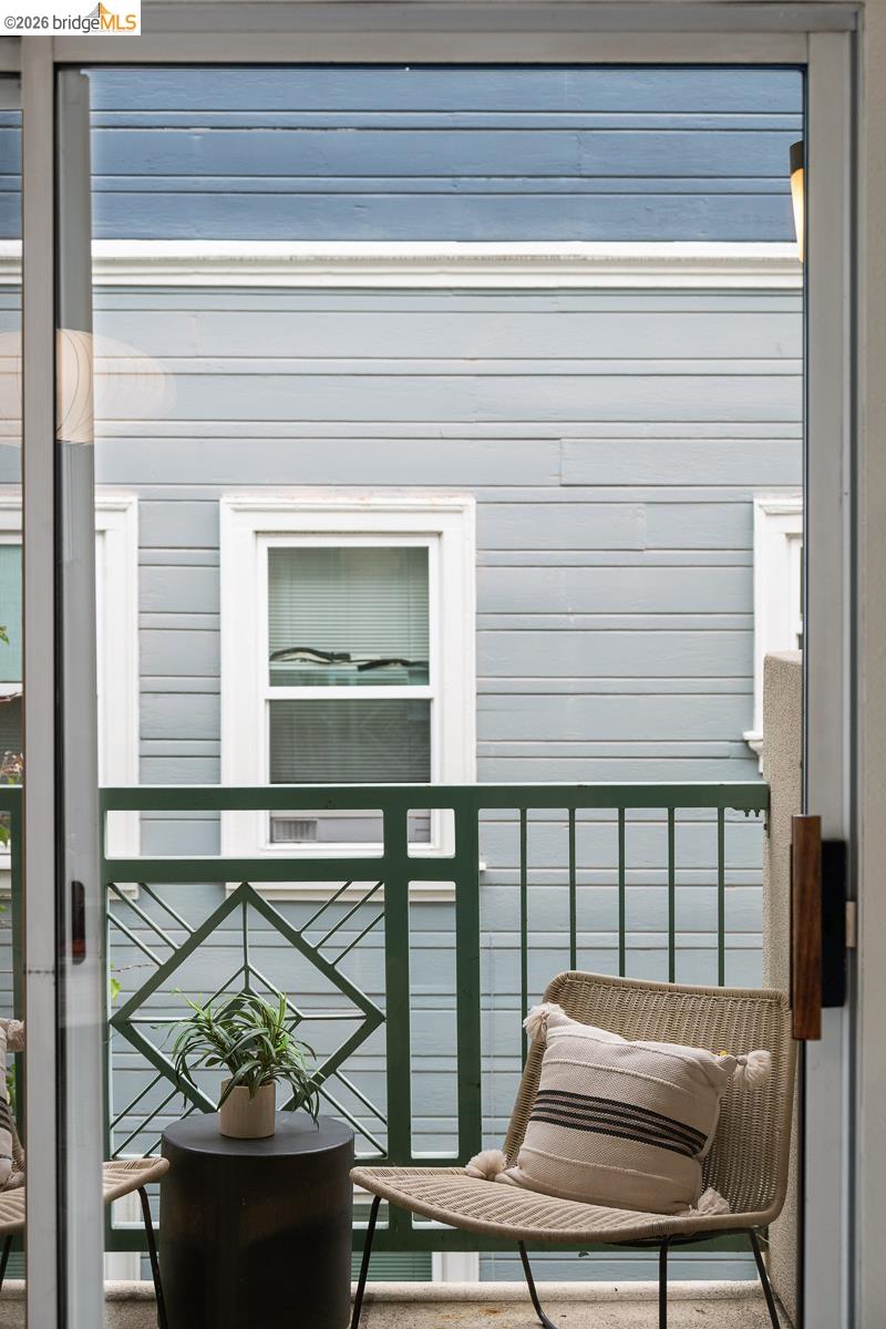 2029 Channing Way, Unit 3D Berkeley, CA 94704 - Photo 52 of 54 Sliding glass door opening to a private balcony featuring a decorative metal railing