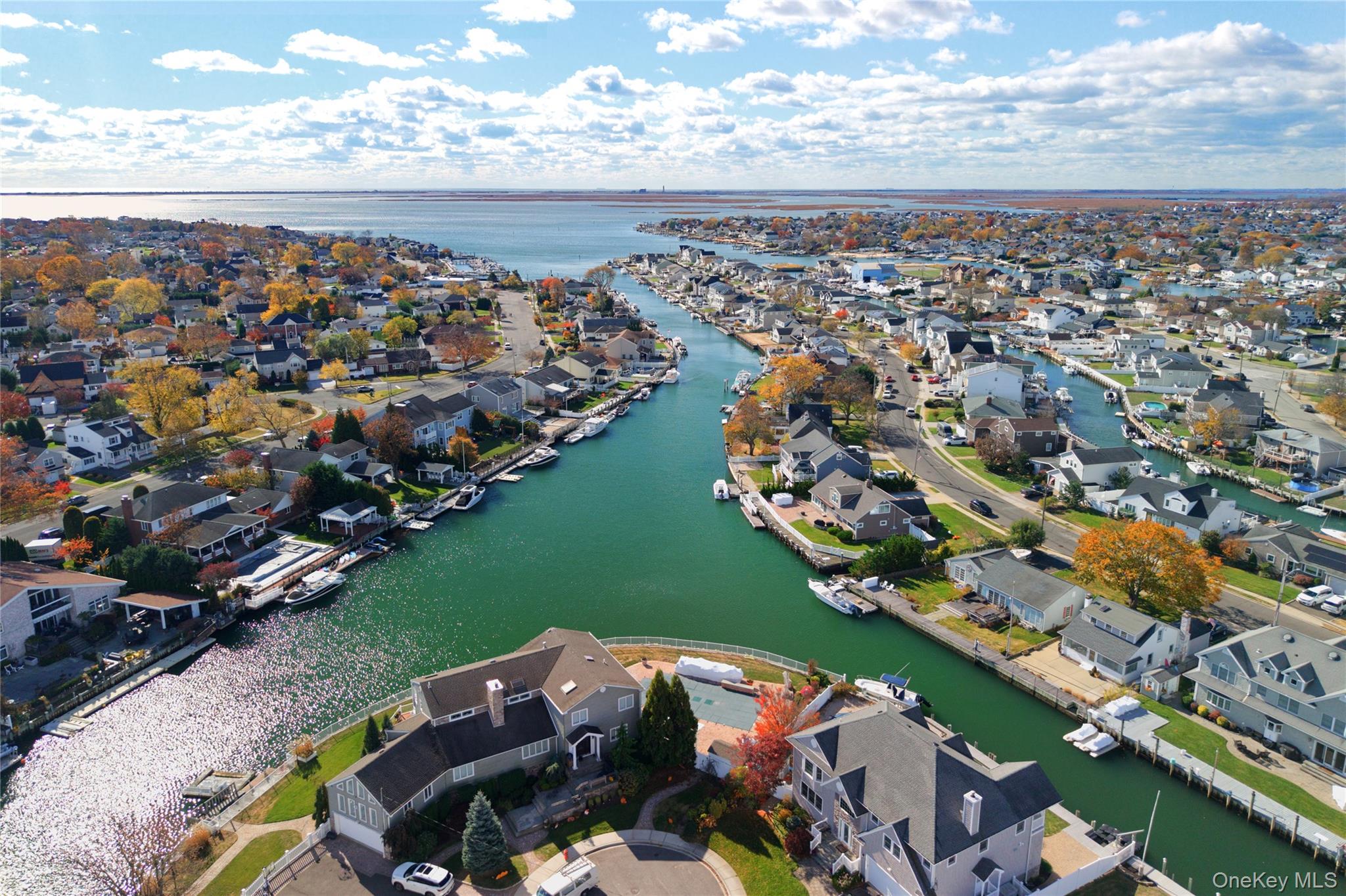 4530 Merrick Road Massapequa, NY 11758 - Photo 22 of 33 an aerial view of a house with a lake