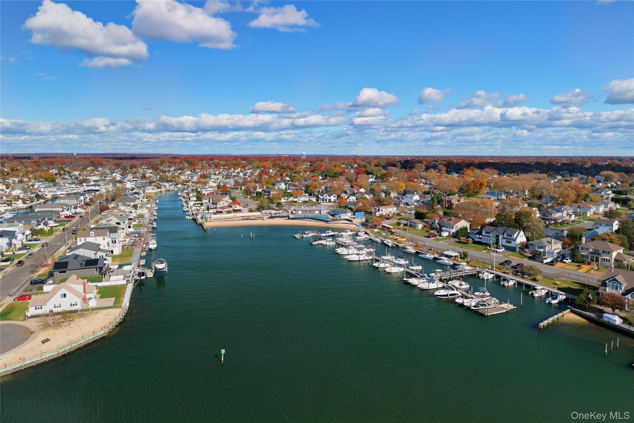 4530 Merrick Road Massapequa, NY 11758 - Photo 23 of 33 an aerial view of a house with a yard