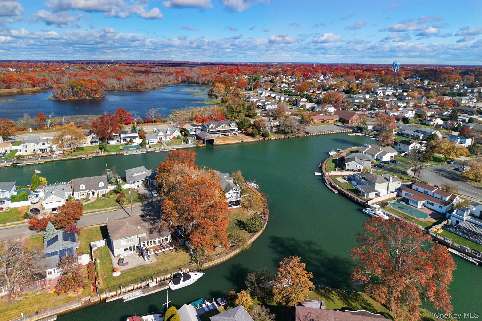 4530 Merrick Road Massapequa, NY 11758 - Photo 6 of 33 an aerial view of a houses with a lake view