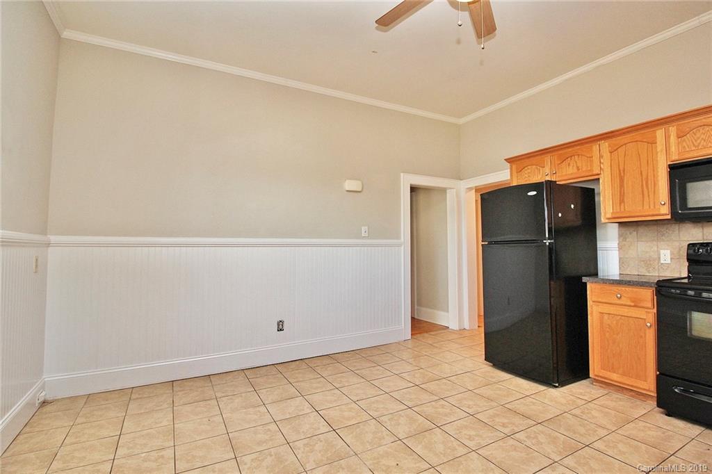 694 Main Street Southwest Concord, NC 28027 - Photo 15 of 33 a kitchen with stainless steel appliances a refrigerator and a stove top oven