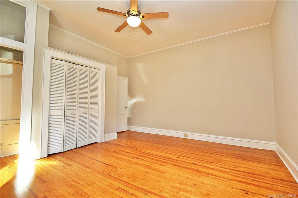 694 Main Street Southwest Concord, NC 28027 - Photo 20 of 33 a view of a room with wooden floor and fan