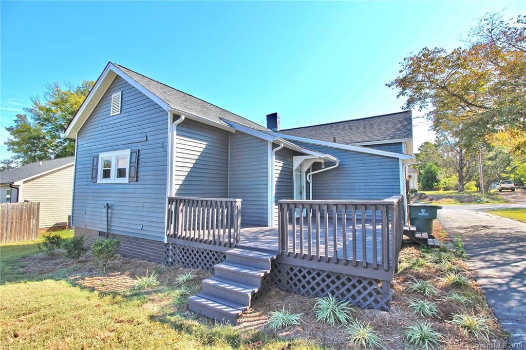 694 Main Street Southwest Concord, NC 28027 - Photo 26 of 33 a front view of a house with a yard