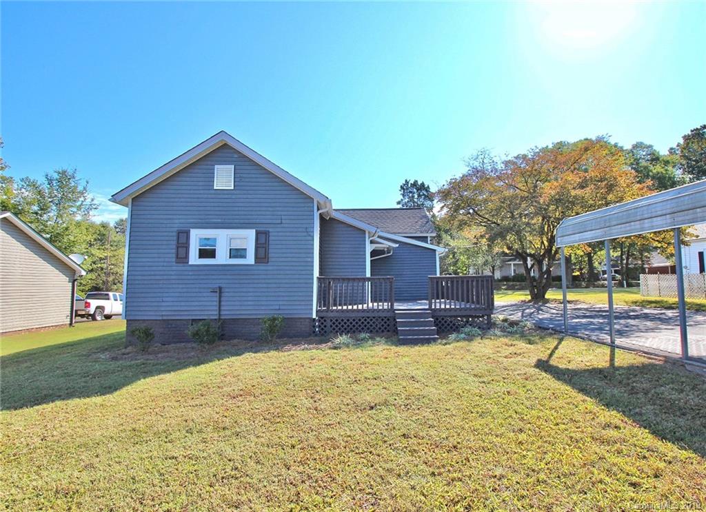 694 Main Street Southwest Concord, NC 28027 - Photo 29 of 33 a house view with a sitting space and garden