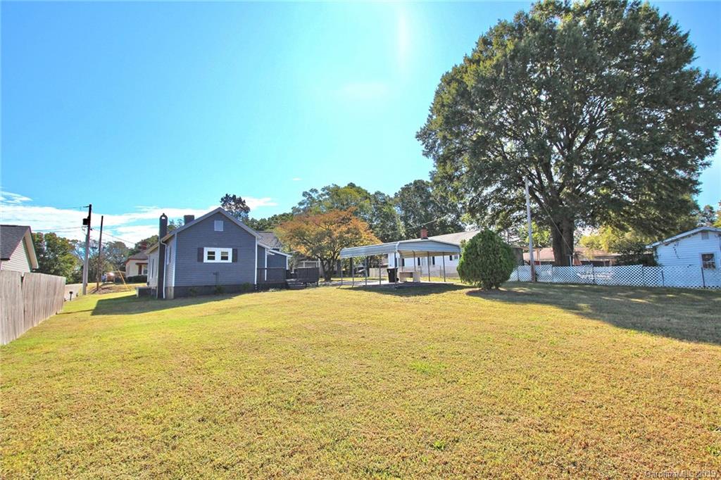 694 Main Street Southwest Concord, NC 28027 - Photo 30 of 33 a swimming pool with trees in front of it