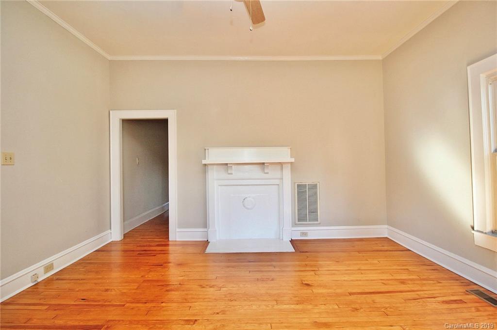 694 Main Street Southwest Concord, NC 28027 - Photo 6 of 33 a view of a refrigerator in an empty room