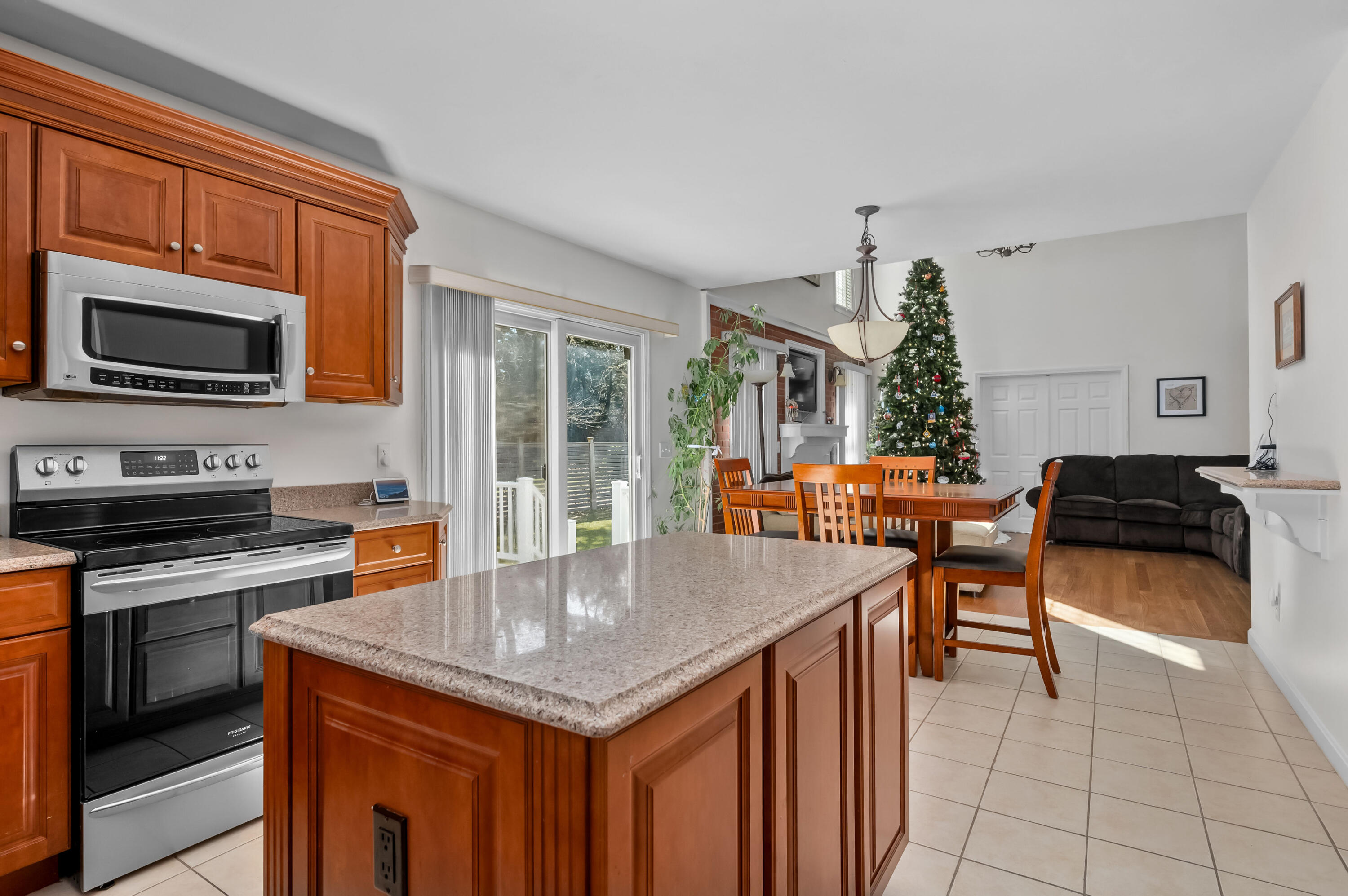 2 Centerville Avenue Centerville, MA 02632 - Photo 11 of 40 a kitchen with stainless steel appliances granite countertop a stove top oven a sink dishwasher and cabinets