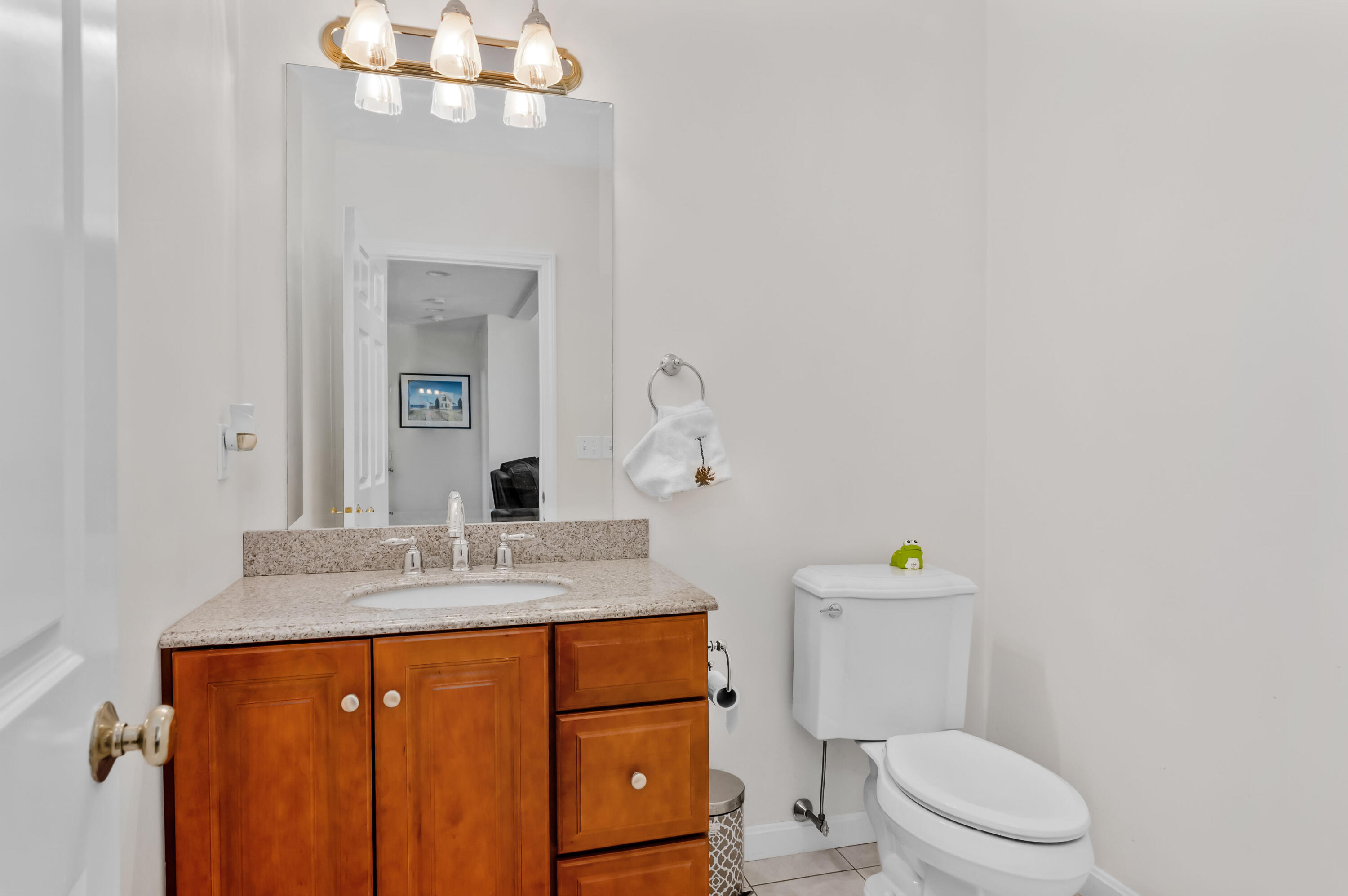 2 Centerville Avenue Centerville, MA 02632 - Photo 19 of 40 a bathroom with a granite countertop sink mirror vanity and toilet