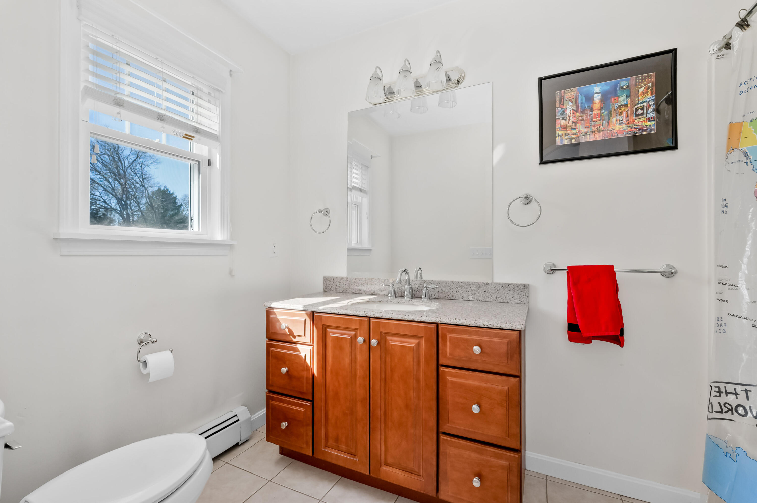 2 Centerville Avenue Centerville, MA 02632 - Photo 22 of 40 a bathroom with a granite countertop toilet sink and mirror