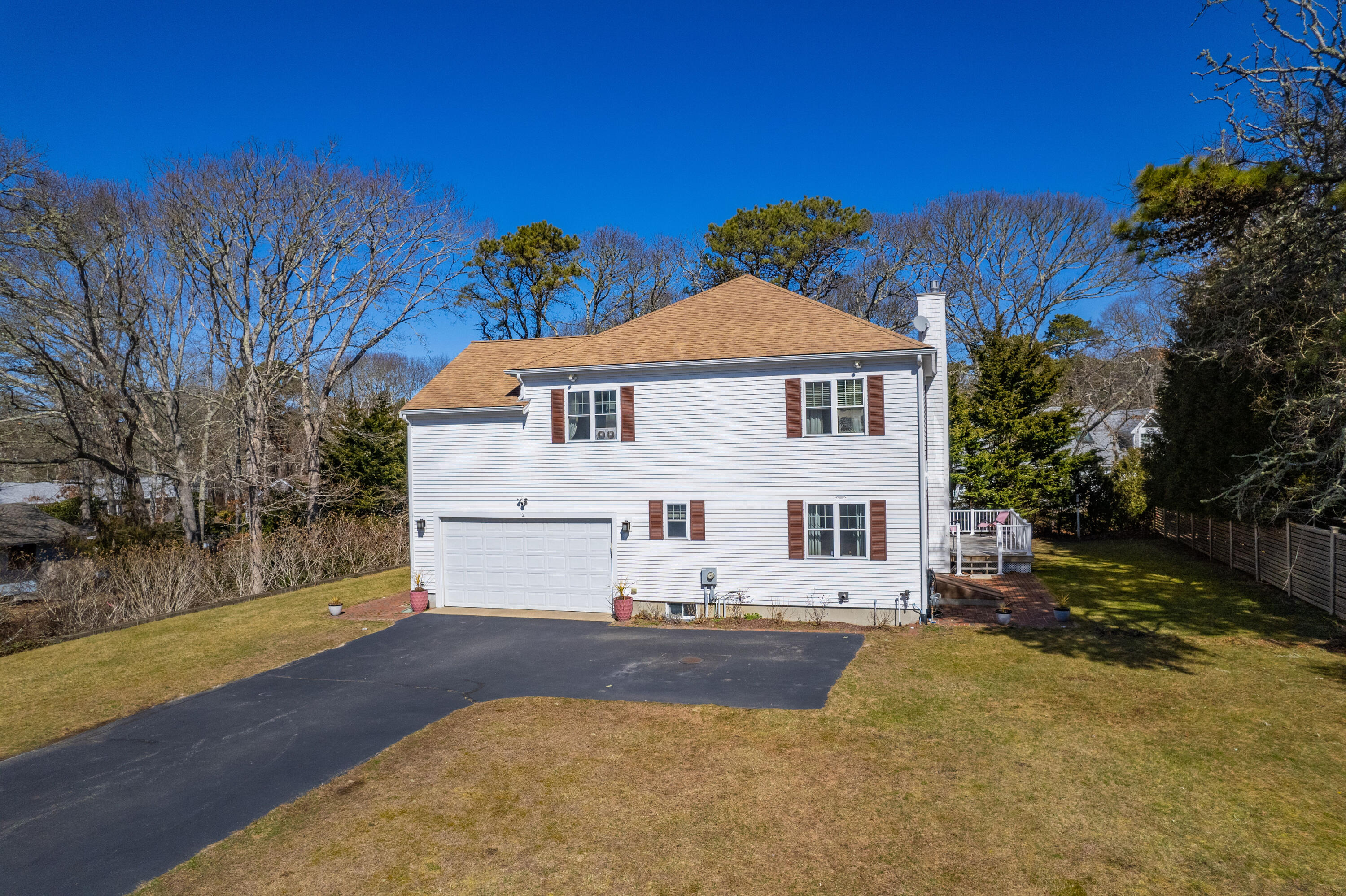 2 Centerville Avenue Centerville, MA 02632 - Photo 3 of 40 a view of a white house with a yard