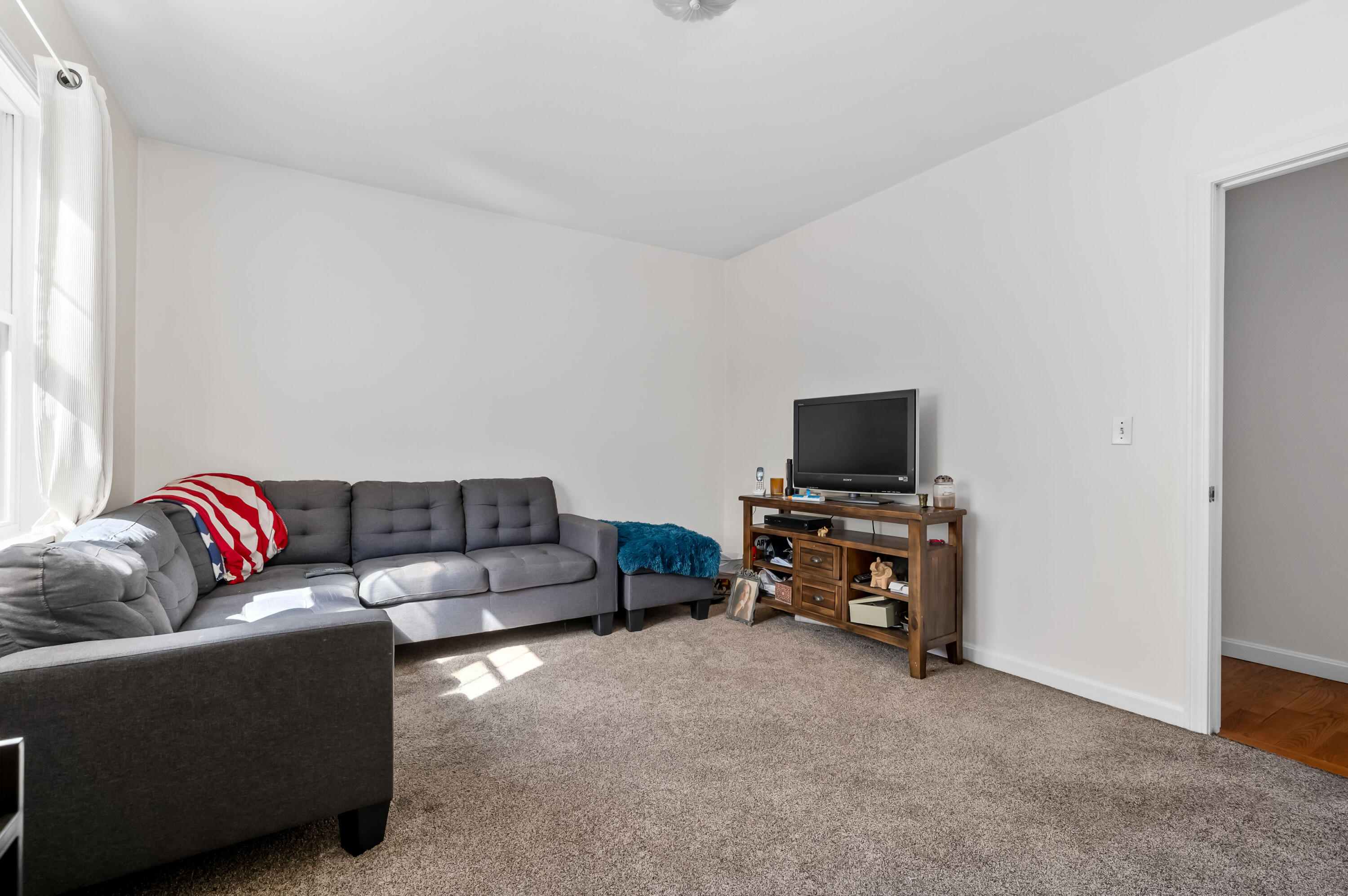 2 Centerville Avenue Centerville, MA 02632 - Photo 31 of 40 a living room with furniture and a flat screen tv