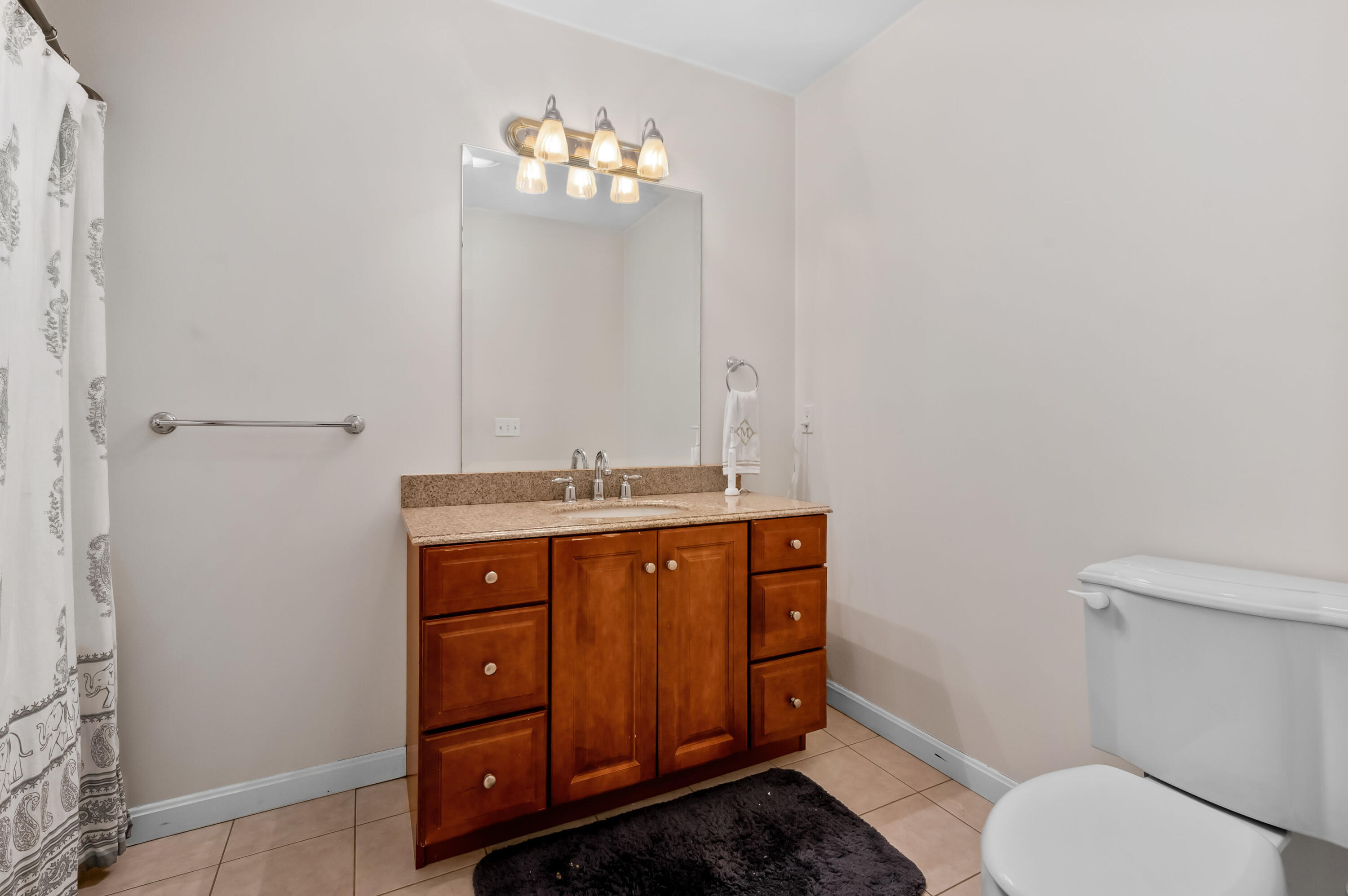 2 Centerville Avenue Centerville, MA 02632 - Photo 33 of 40 a bathroom with a toilet a sink and mirror