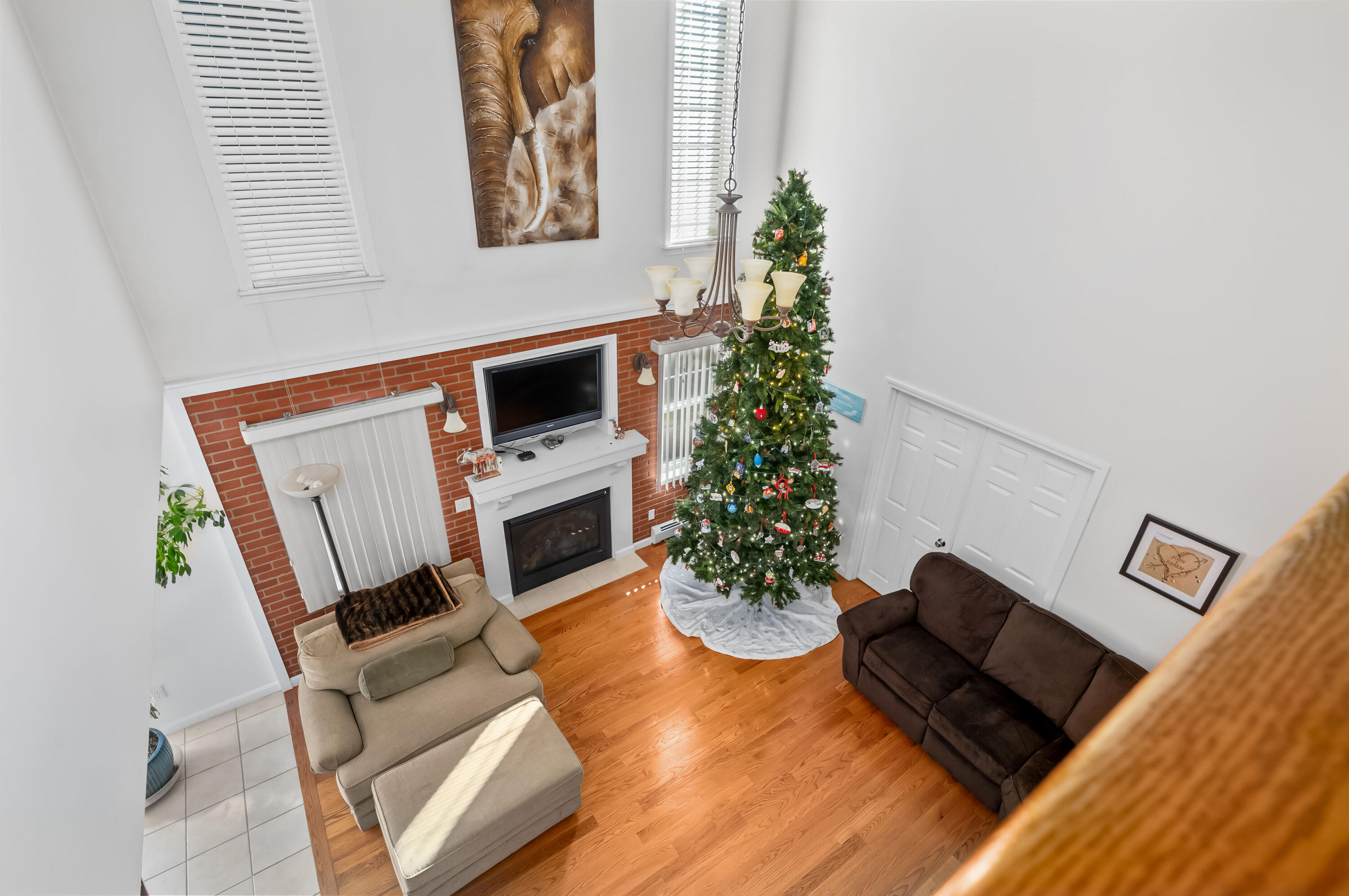 2 Centerville Avenue Centerville, MA 02632 - Photo 35 of 40 a living room with furniture a flat screen tv and a fireplace