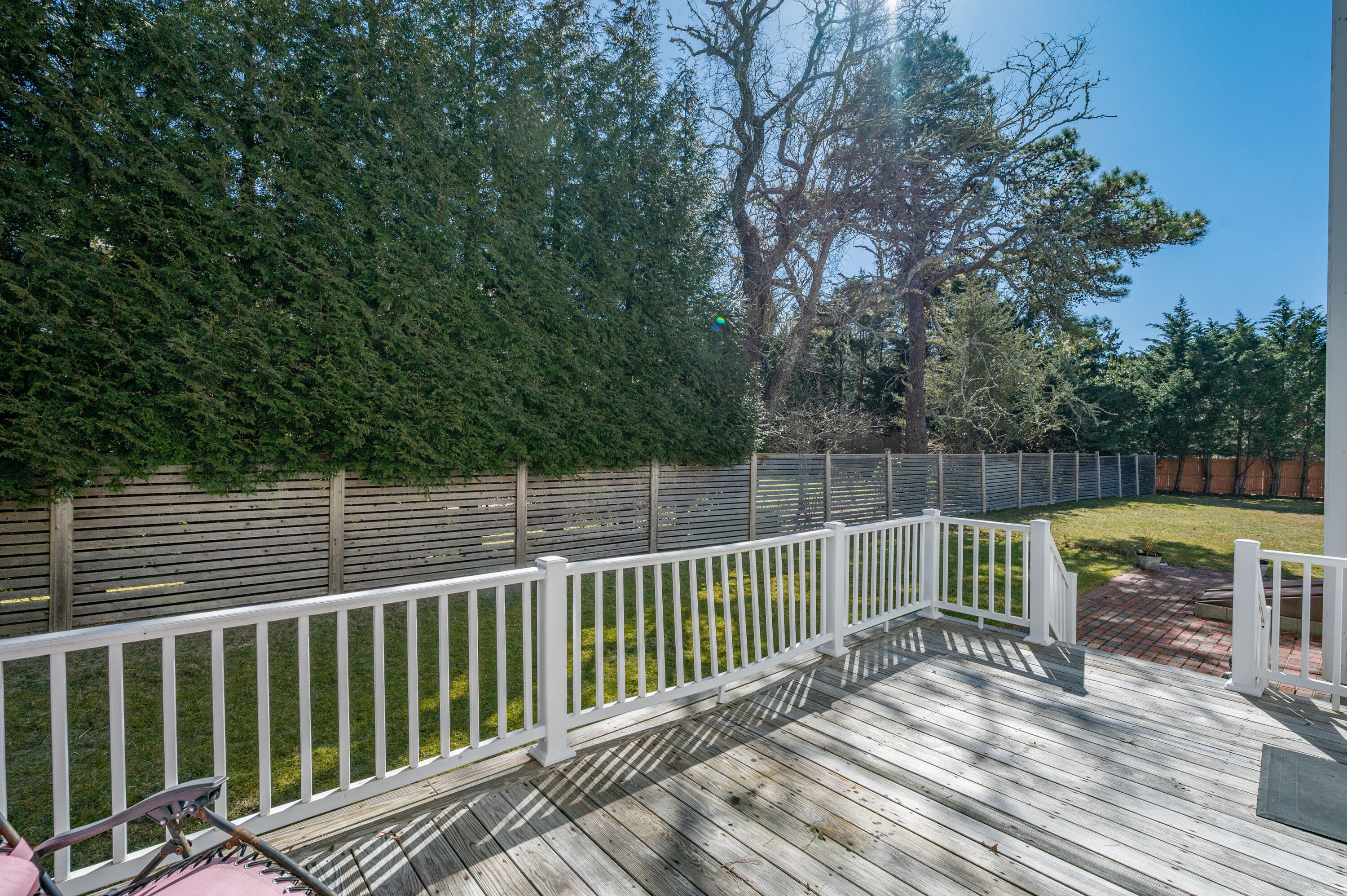 2 Centerville Avenue Centerville, MA 02632 - Photo 40 of 40 a view of balcony with wooden fence and floor to ceiling window