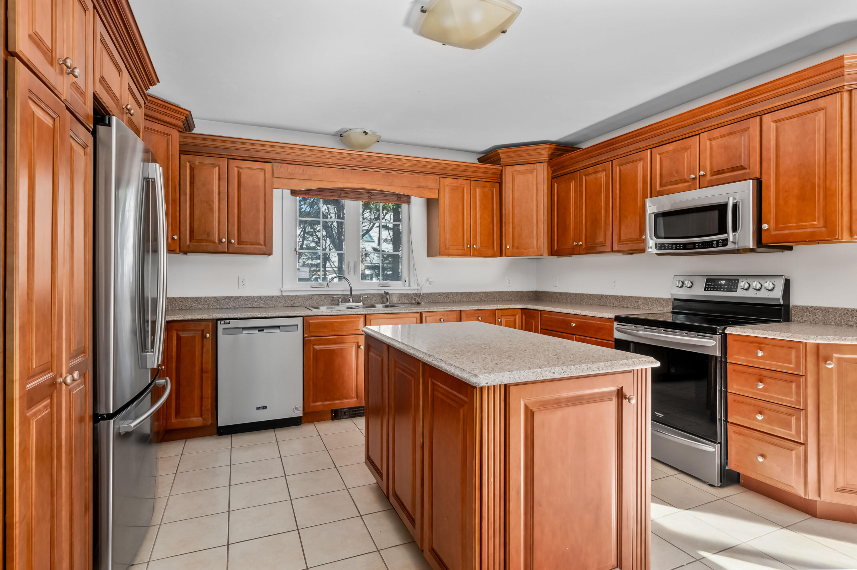 2 Centerville Avenue Centerville, MA 02632 - Photo 8 of 40 a kitchen with stainless steel appliances granite countertop a stove top oven a sink dishwasher and a microwave oven on the blue kitchen countertops