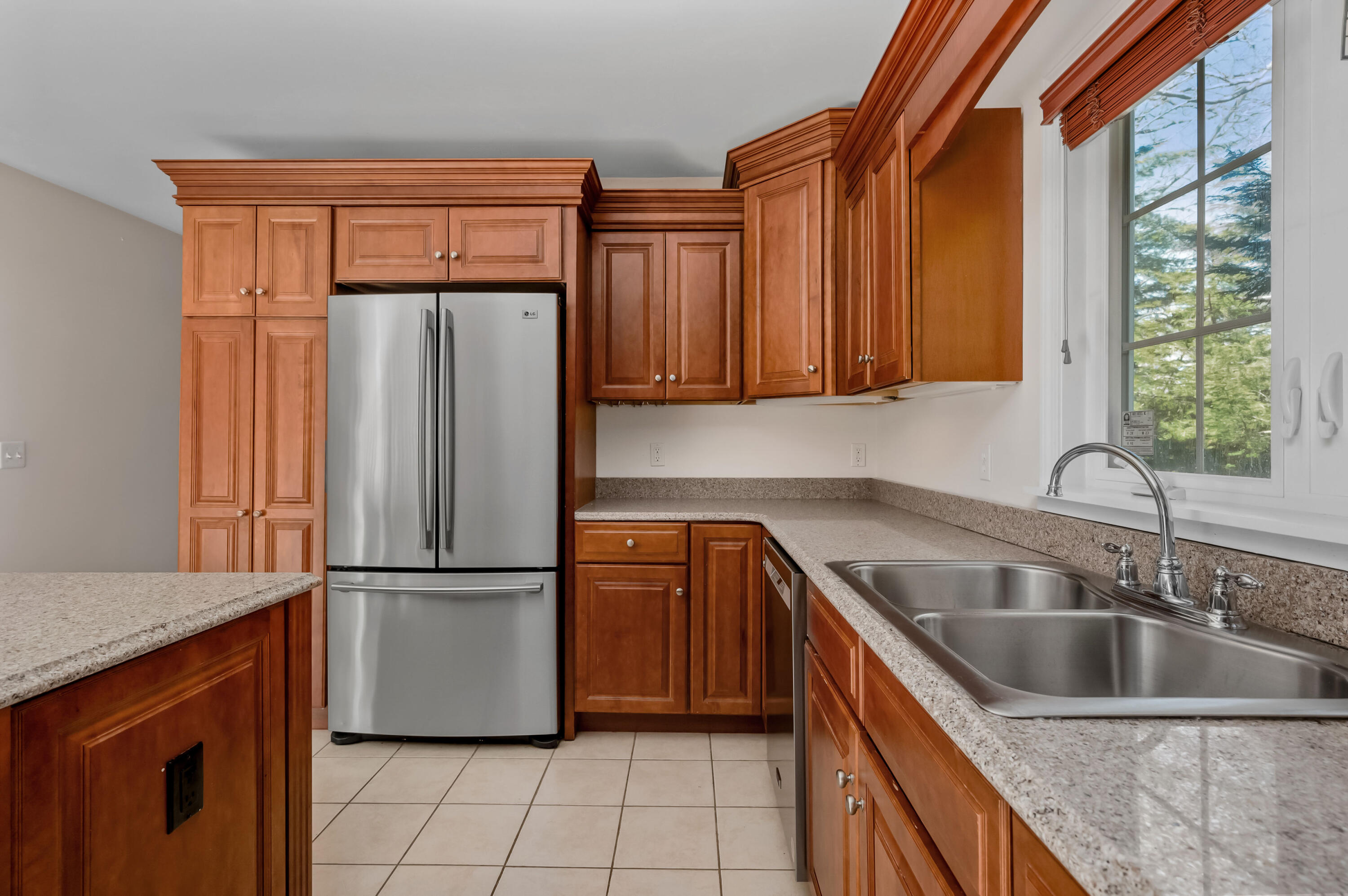 2 Centerville Avenue Centerville, MA 02632 - Photo 10 of 40 a kitchen with a refrigerator sink and cabinets