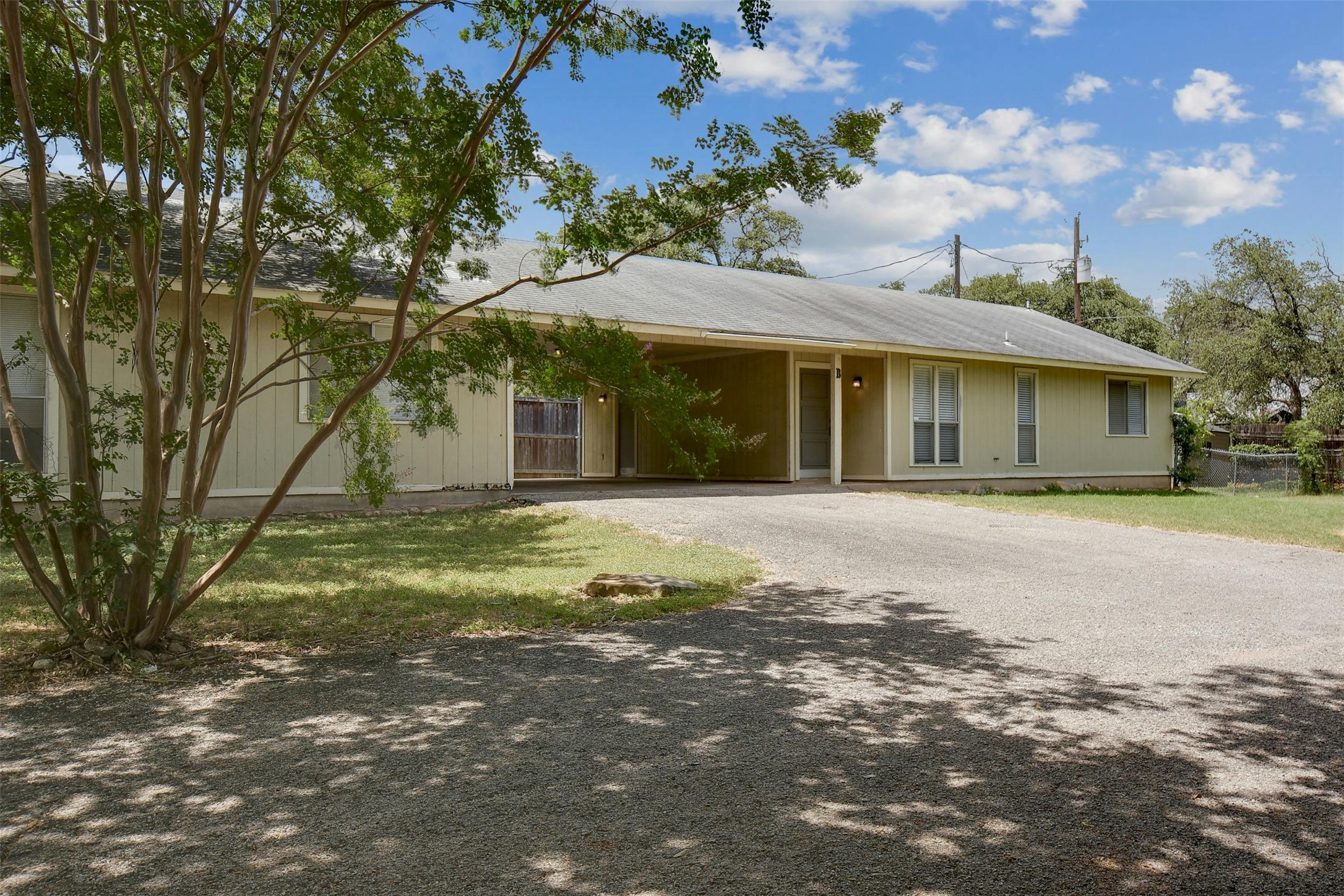 3114 Plantation Road, Unit A Austin, TX 78745 - Photo 2 of 15 A welcoming front exterior offers a convenient carport and ample natural landscaping.