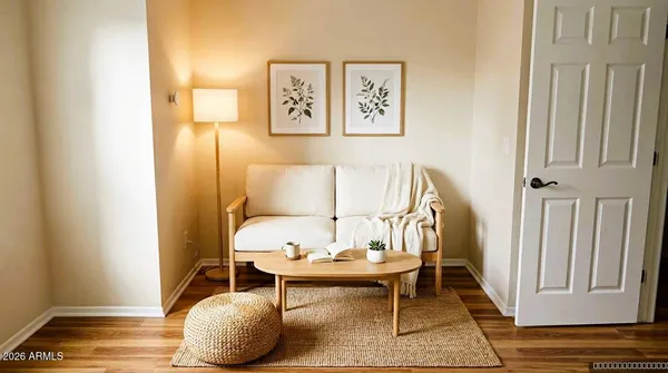 a living room with furniture and a rug