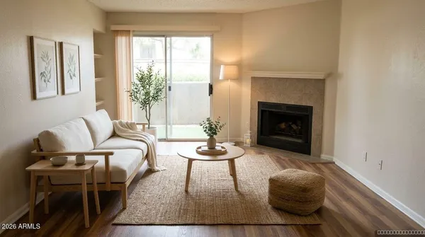 a living room with furniture and a fireplace