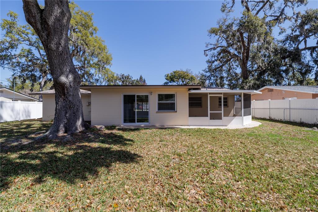1016 Cherokee Ranch Road Holly Hill, FL 32117 - Photo 22 of 23 a view of a house with a yard
