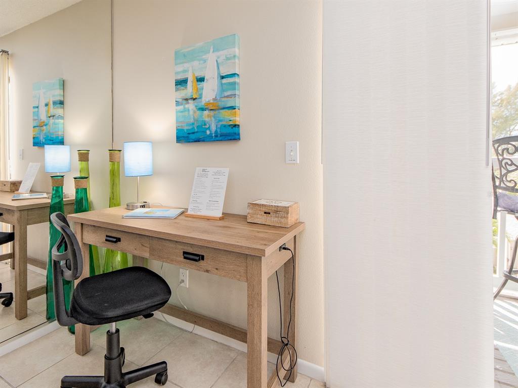2406 Gulf Boulevard, Unit 204 Indian Rocks Beach, FL 33785 - Photo 19 of 39 a view of a kitchen with a stove and a refrigerator