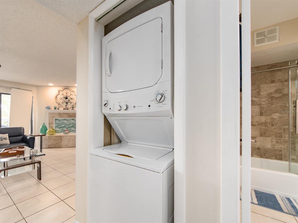 2406 Gulf Boulevard, Unit 204 Indian Rocks Beach, FL 33785 - Photo 20 of 39 a utility room with dryer and washer