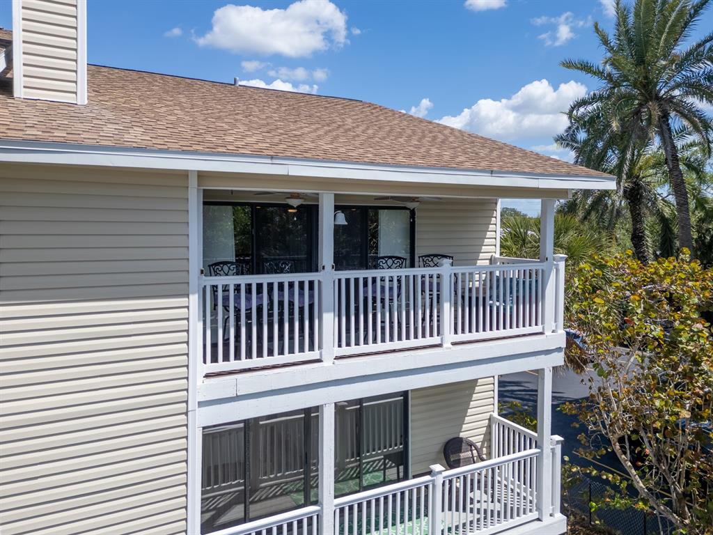 2406 Gulf Boulevard, Unit 204 Indian Rocks Beach, FL 33785 - Photo 10 of 39 a view of a house with a deck