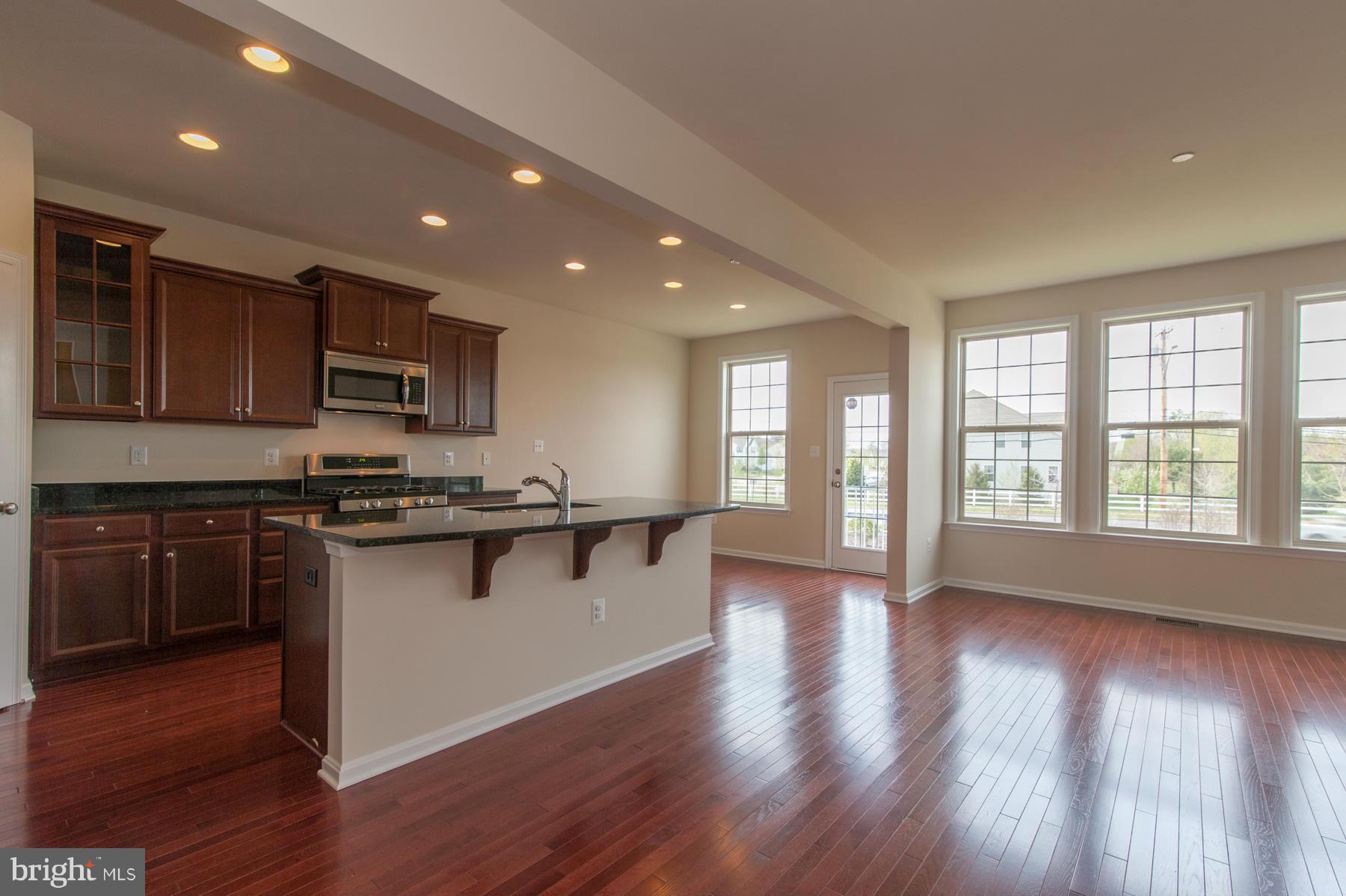 8153 Ridgely Loop Severn, MD 21144 - Photo 19 of 30 Family Room to Kitchen
