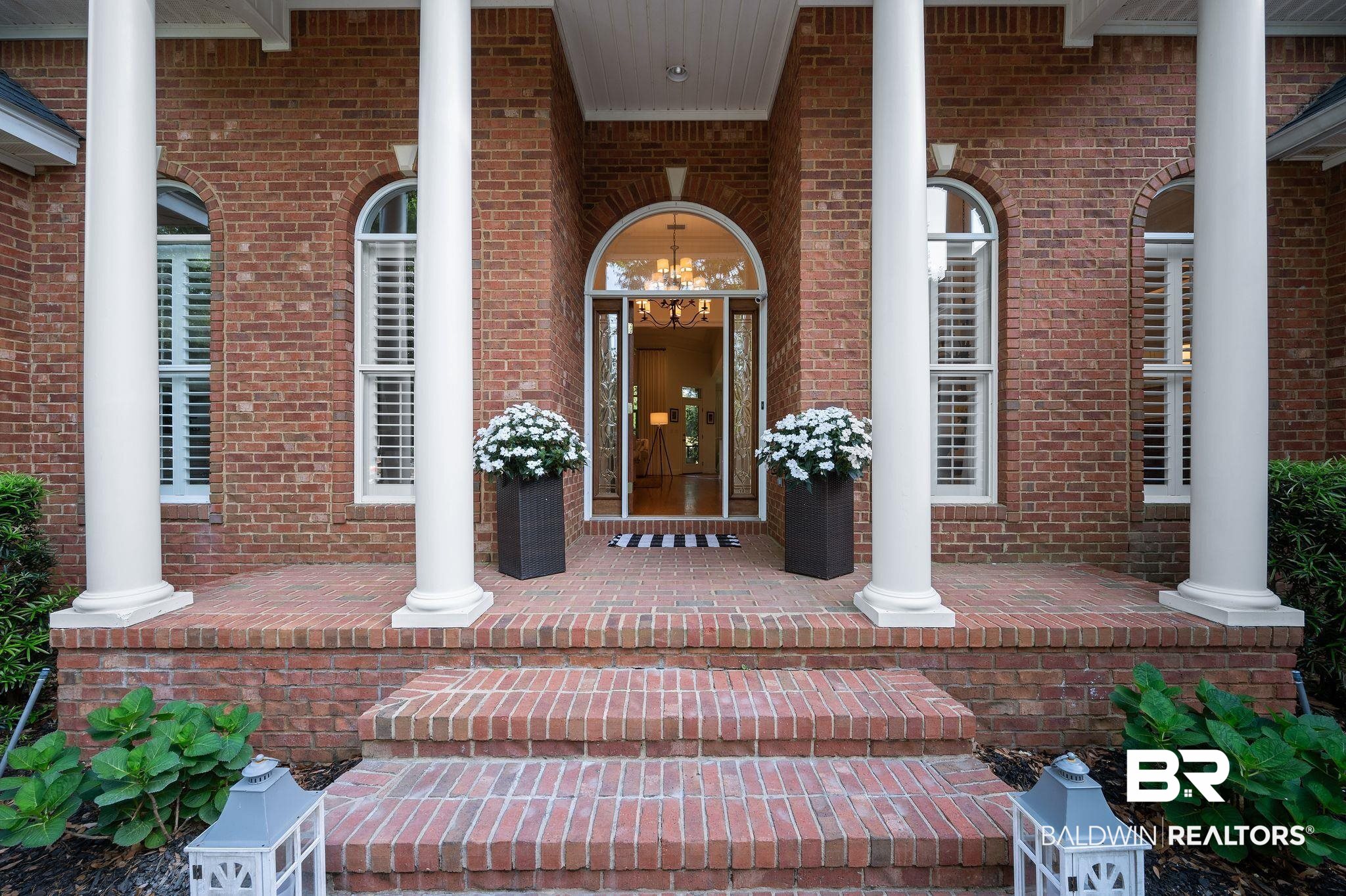 30151 Dolive Ridge Daphne, AL 36527 - Photo 2 of 37 View of exterior entry featuring covered porch and brick siding