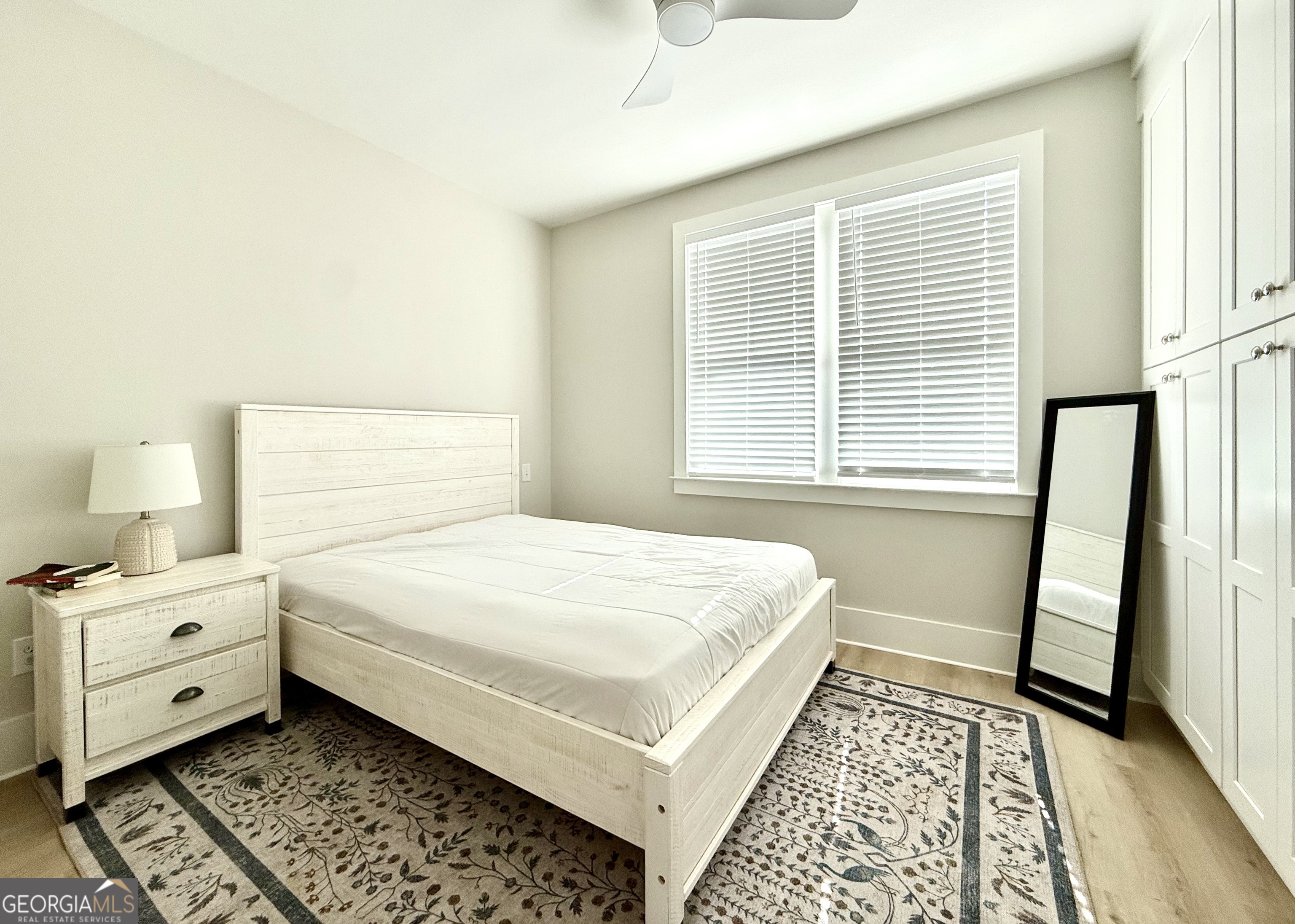 1 East Jarrard Street Cleveland, GA 30528 - Photo 14 of 23 a bedroom with a white bed and a window