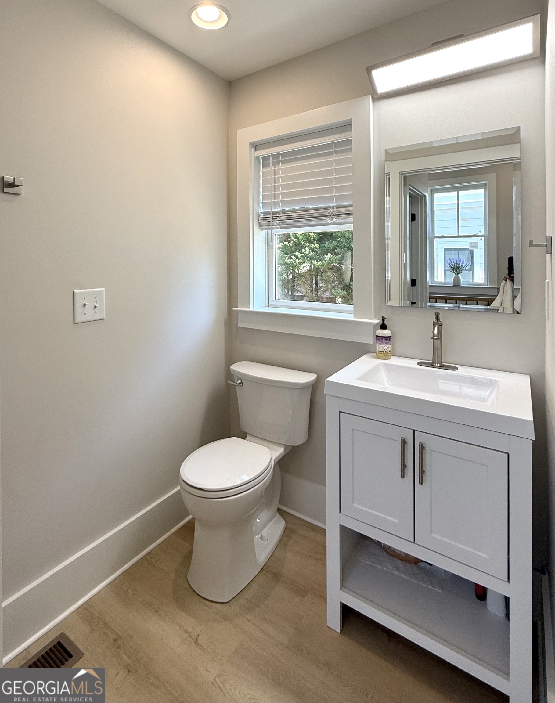 1 East Jarrard Street Cleveland, GA 30528 - Photo 16 of 23 a bathroom with a toilet sink and mirror