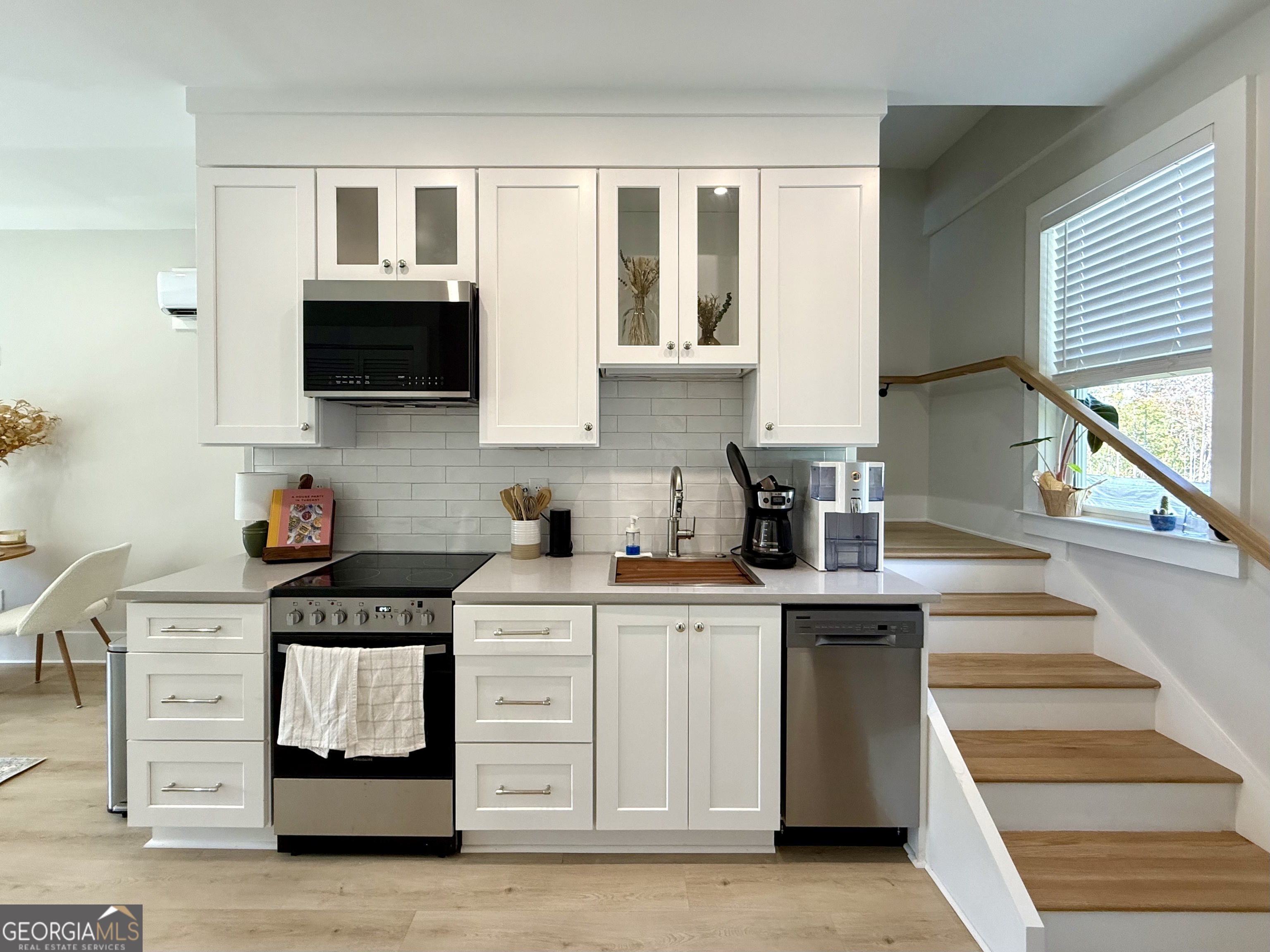 1 East Jarrard Street Cleveland, GA 30528 - Photo 8 of 23 a kitchen with stainless steel appliances a stove microwave and sink