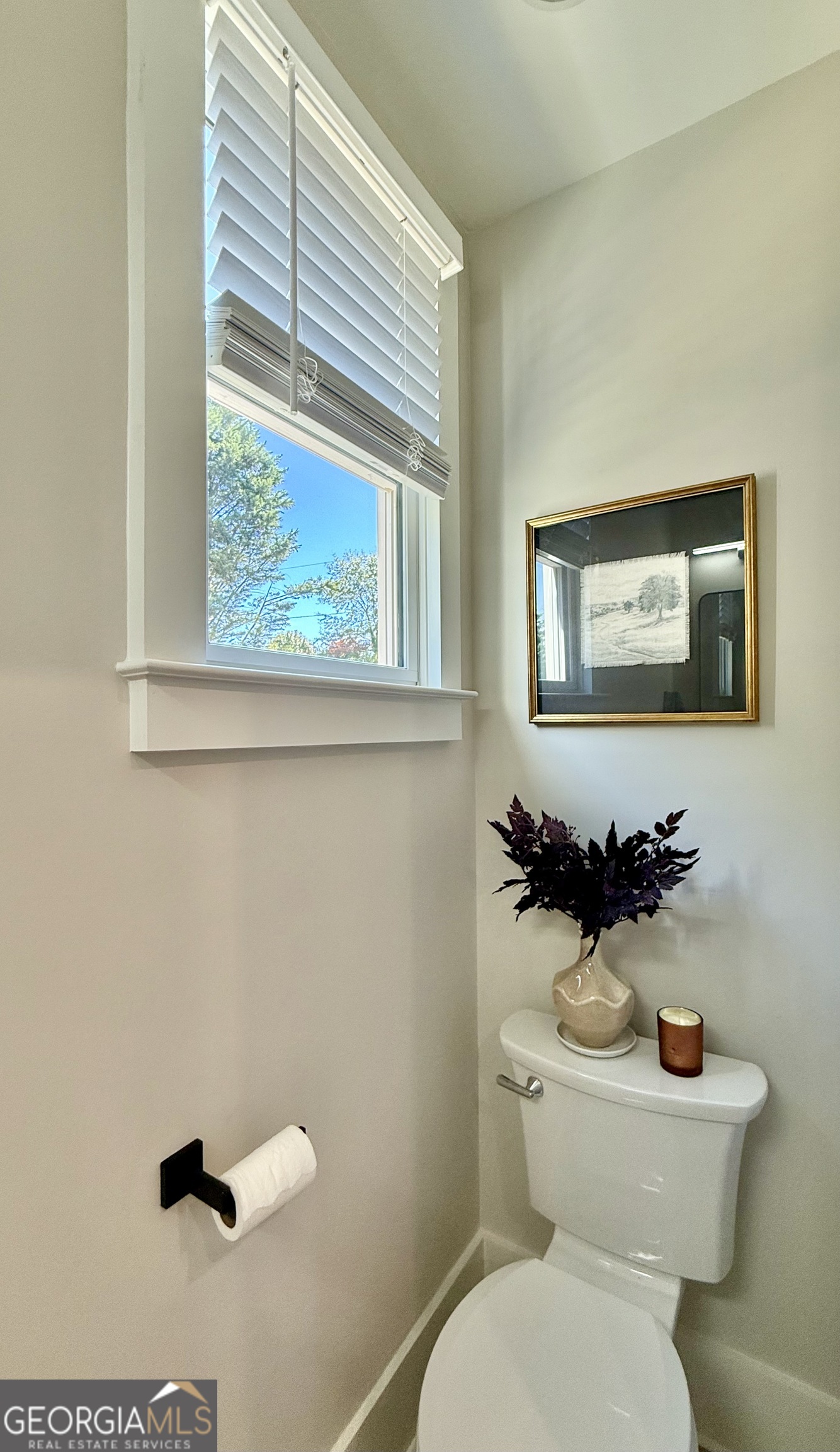1 East Jarrard Street Cleveland, GA 30528 - Photo 10 of 23 a white toilet sitting next to a bathroom sink