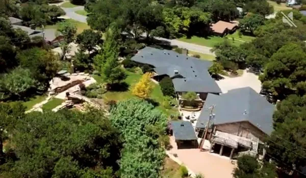 a view of a patio with couches chairs and potted plants