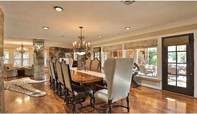 a kitchen with stainless steel appliances granite countertop a sink and a refrigerator